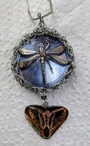 glass dragonfly and silver moth
